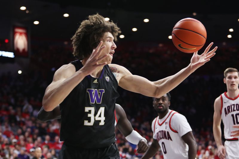 Jan 5, 2023; Tucson, Arizona, USA; Washington Huskies center Braxton Meah (34) gets a rebound in the first half at McKale Center. Mandatory Credit: Zachary BonDurant-USA TODAY Sports