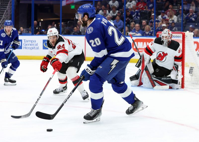 Jan 27, 2024; Tampa, Florida, USA; Tampa Bay Lightning left wing Nicholas Paul (20) skates with the puck against the New Jersey Devils during the third period at Amalie Arena. Mandatory Credit: Kim Klement Neitzel-USA TODAY Sports