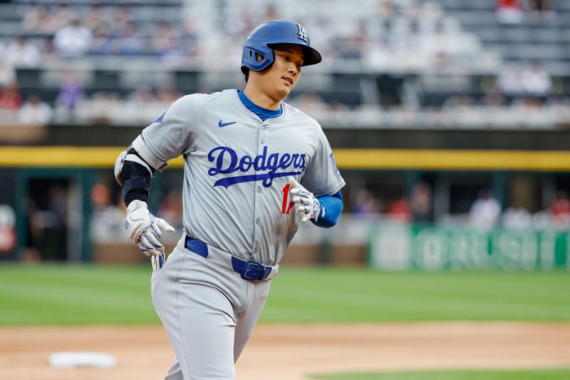 Jun 25, 2024; Chicago, Illinois, USA; Los Angeles Dodgers designated hitter Shohei Ohtani (17) rounds the bases after hitting a solo home run against the Chicago White Sox during the first inning at Guaranteed Rate Field. Mandatory Credit: Kamil Krzaczynski-USA TODAY Sports