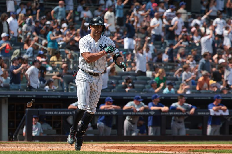 Aug 11, 2024; Bronx, New York, USA; New York Yankees designated hitter Giancarlo Stanton (27) celebrates after hitting a three run home run during the fifth inning against the Texas Rangers at Yankee Stadium. Mandatory Credit: Vincent Carchietta-USA TODAY Sports