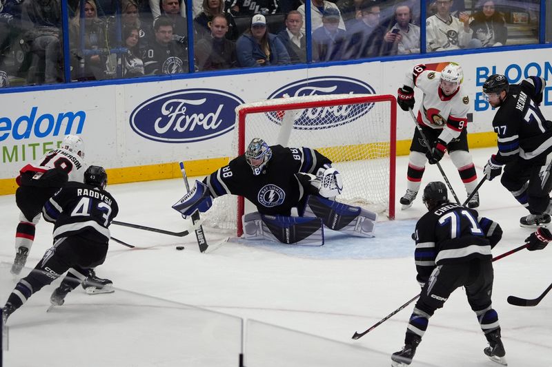 Feb 19, 2024; Tampa, Florida, USA; Tampa Bay Lightning goaltender Andrei Vasilevskiy (88) blocks a shot against the Ottawa Senators during the third period at Amalie Arena. Mandatory Credit: Dave Nelson-USA TODAY Sports