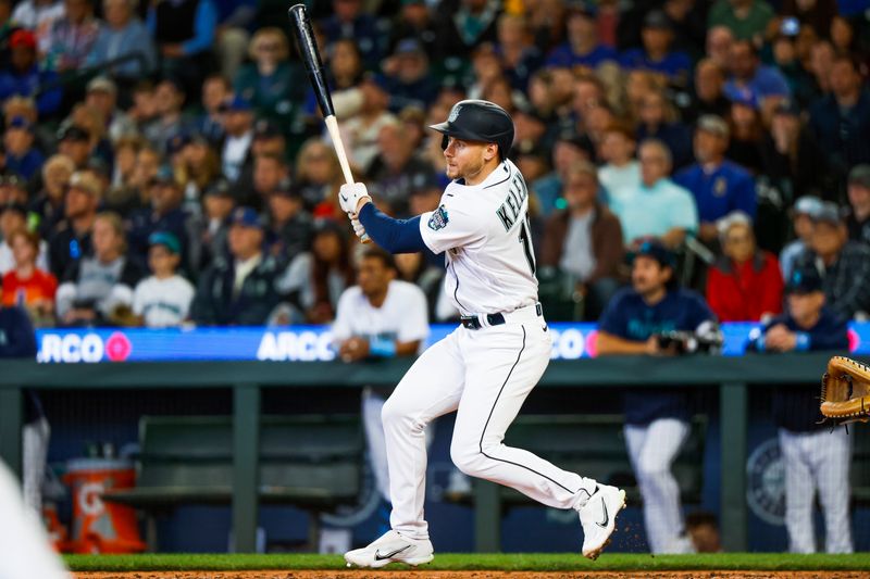 Jun 18, 2023; Seattle, Washington, USA; Seattle Mariners left fielder Jarred Kelenic (10) hits a three-run triple against the Chicago White Sox during the eighth inning at T-Mobile Park. Mandatory Credit: Joe Nicholson-USA TODAY Sports