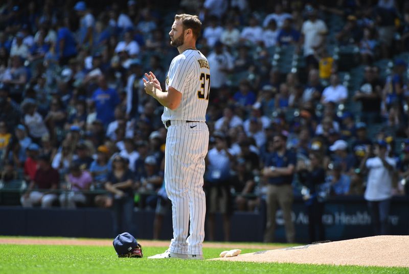 Aug 27, 2023; Milwaukee, Wisconsin, USA; Milwaukee Brewers starting pitcher Adrian Houser (37) works the ball before taking the mound against the San Diego Padres at American Family Field. Mandatory Credit: Michael McLoone-USA TODAY Sports