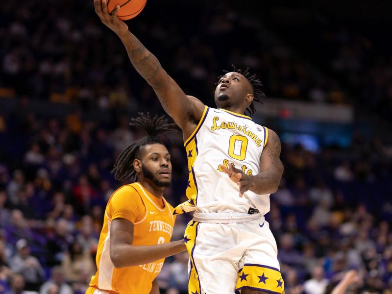 Jan 21, 2023; Baton Rouge, Louisiana, USA;  LSU Tigers guard Trae Hannibal (0) drives to the basket against the Tennessee Volunteers during the first half at Pete Maravich Assembly Center. Mandatory Credit: Stephen Lew-USA TODAY Sports