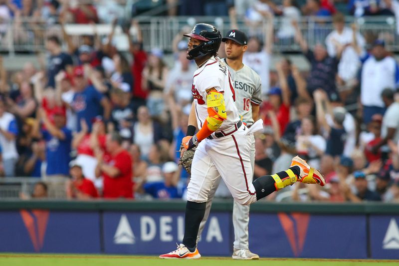 Jun 27, 2023; Atlanta, Georgia, USA; Atlanta Braves right fielder Ronald Acuna Jr. (13) hits a home run against the Minnesota Twins in the second inning at Truist Park. Mandatory Credit: Brett Davis-USA TODAY Sports
