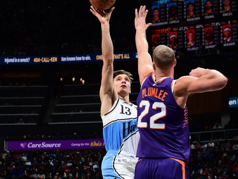 ATLANTA, GA - JANUARY 14:  Bogdan Bogdanovic #13 of the Atlanta Hawks shoots the ball during the game against the Phoenix Suns on January 14, 2025 at State Farm Arena in Atlanta, Georgia.  NOTE TO USER: User expressly acknowledges and agrees that, by downloading and/or using this Photograph, user is consenting to the terms and conditions of the Getty Images License Agreement. Mandatory Copyright Notice: Copyright 2025 NBAE (Photo by Scott Cunningham/NBAE via Getty Images)