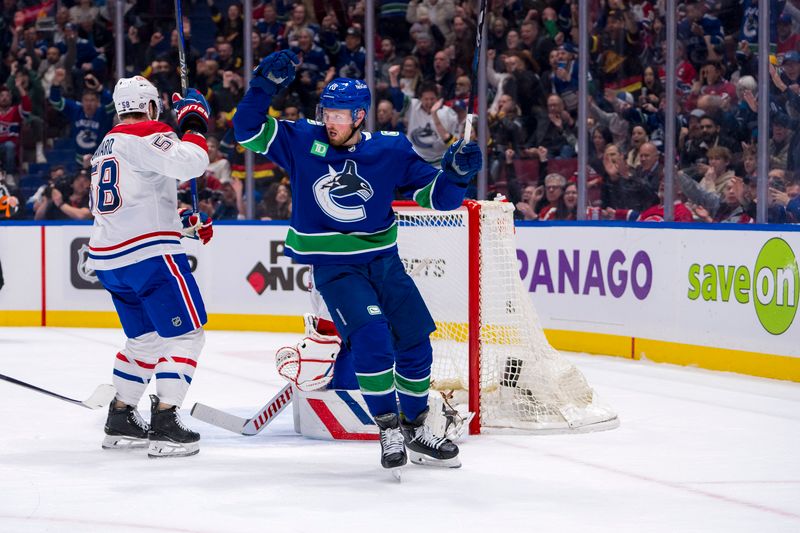 Mar 21, 2024; Vancouver, British Columbia, CAN; Vancouver Canucks forward Sam Lafferty (18) celebrates a goal scored by defenseman Nikita Zadorov (91) against the Montreal Canadiens in the first period at Rogers Arena. Mandatory Credit: Bob Frid-USA TODAY Sports