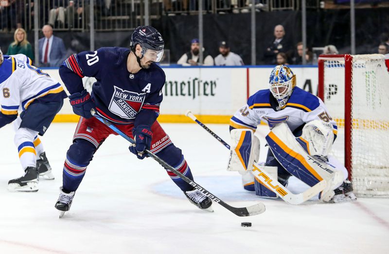 Mar 9, 2024; New York, New York, USA; New York Rangers left wing Chris Kreider (20) takes a shot at St. Louis Blues goalie Jordan Binnington (50) during the second period at Madison Square Garden. Mandatory Credit: Danny Wild-USA TODAY Sports