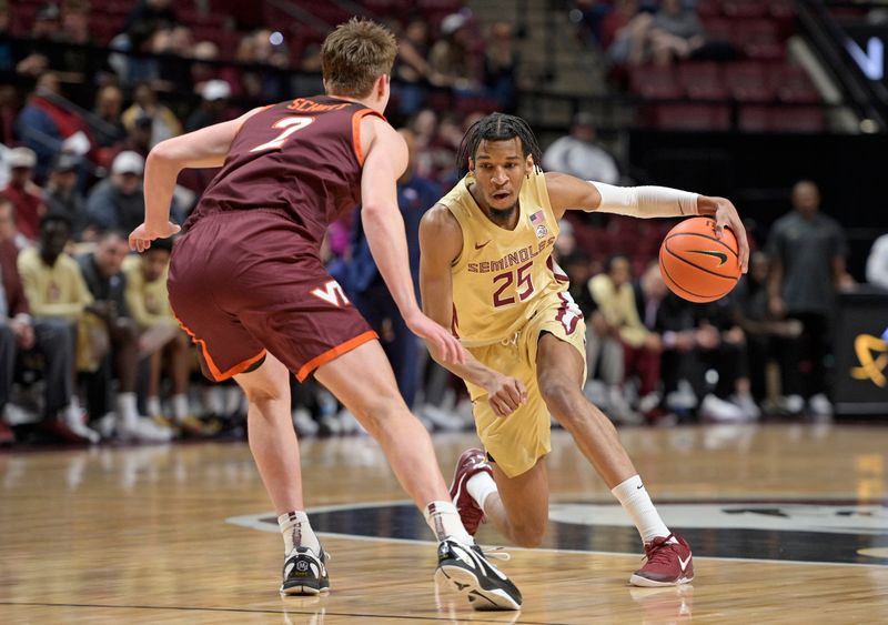 Jan 29, 2025; Tallahassee, Florida, USA; Florida State Seminoles guard Justin Thomas (25) drives to the net past Virginia Tech Hokies guard Brandon Rechsteiner (7) during the first half at Donald L. Tucker Center. Mandatory Credit: Melina Myers-Imagn Images