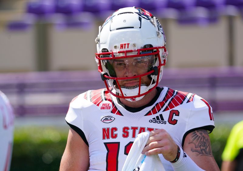 Sep 3, 2022; Greenville, North Carolina, USA;  North Carolina State Wolfpack quarterback Devin Leary (13) looks on against the East Carolina Pirates before the game at Dowdy-Ficklen Stadium. Mandatory Credit: James Guillory-USA TODAY Sports