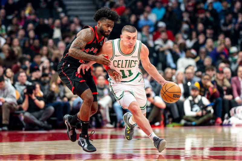 TORONTO, CANADA - FEBRUARY 25: Payton Pritchard #11 of the Boston Celtics brings the ball up court under pressure from Jamal Shead #23 of the Toronto Raptors in the first half at Scotiabank Arena on February 25, 2025 in Toronto, Canada. NOTE TO USER: User expressly acknowledges and agrees that, by downloading and or using this photograph, User is consenting to the terms and conditions of the Getty Images License Agreement. (Photo by Kevin Sousa/Getty Images)