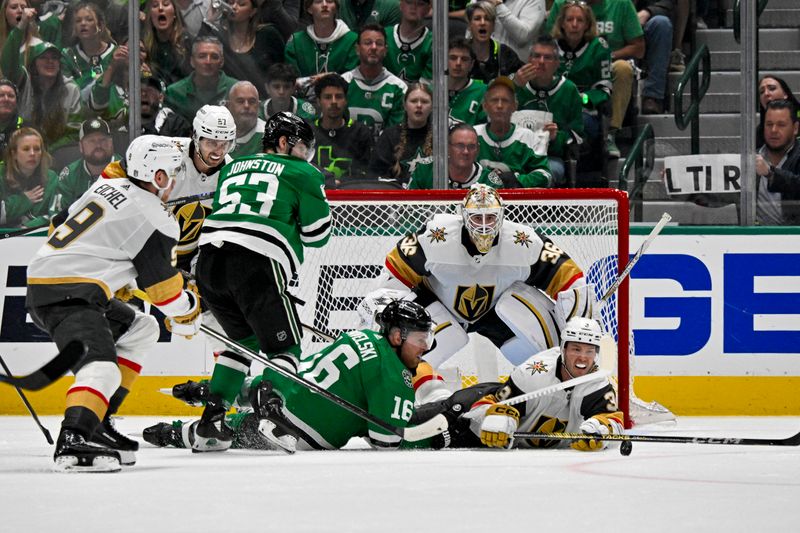 Apr 24, 2024; Dallas, Texas, USA; Vegas Golden Knights goaltender Logan Thompson (36) and defenseman Brayden McNabb (3) and Dallas Stars center Joe Pavelski (16) and center Wyatt Johnston (53) battle for the loose puck in the Vegas crease during the third period in game two of the first round of the 2024 Stanley Cup Playoffs at American Airlines Center. Mandatory Credit: Jerome Miron-USA TODAY Sports