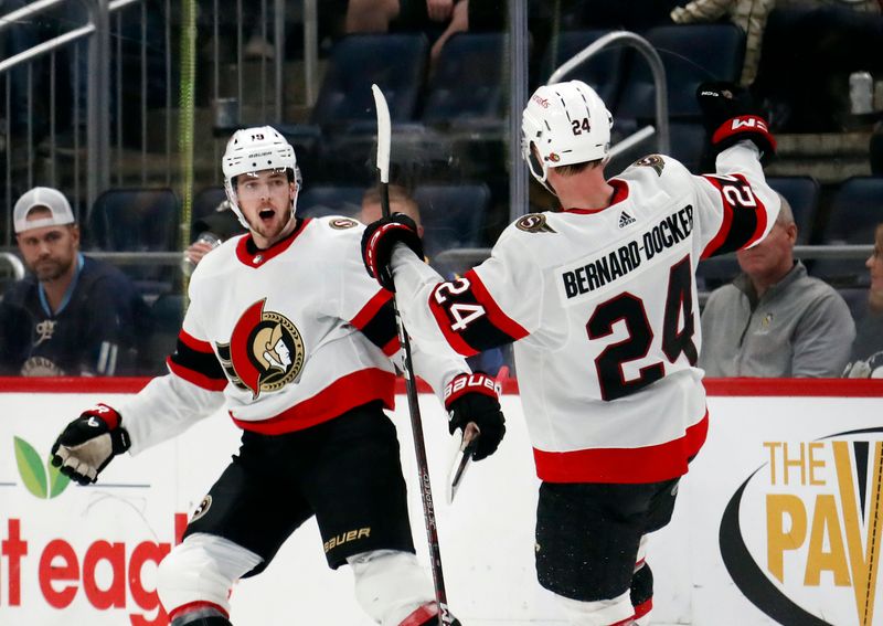 Oct 28, 2023; Pittsburgh, Pennsylvania, USA; Ottawa Senators right wing Drake Batherson (left) celebrates his goal with defenseman Jacob Bernard-Docker (24) against the Pittsburgh Penguins during the third period at PPG Paints Arena. Ottawa won 5-2. Mandatory Credit: Charles LeClaire-USA TODAY Sports