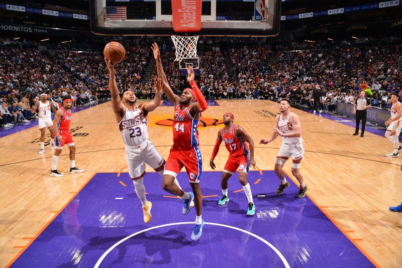 PHOENIX, AZ - MARCH 20:  Eric Gordon #23 of the Phoenix Suns drives to the basket during the game against the Philadelphia 76ers on March 20, 2024 at Footprint Center in Phoenix, Arizona. NOTE TO USER: User expressly acknowledges and agrees that, by downloading and or using this photograph, user is consenting to the terms and conditions of the Getty Images License Agreement. Mandatory Copyright Notice: Copyright 2024 NBAE (Photo by Barry Gossage/NBAE via Getty Images)