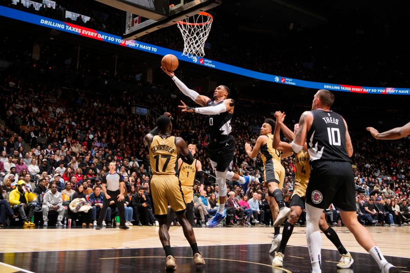 TORONTO, CANADA - JANUARY 26: Russell Westbrook #0 of the LA Clippers drives to the basket during the game against the Toronto Raptors on January 26, 2024 at the Scotiabank Arena in Toronto, Ontario, Canada.  NOTE TO USER: User expressly acknowledges and agrees that, by downloading and or using this Photograph, user is consenting to the terms and conditions of the Getty Images License Agreement.  Mandatory Copyright Notice: Copyright 2024 NBAE (Photo by Mark Blinch/NBAE via Getty Images)