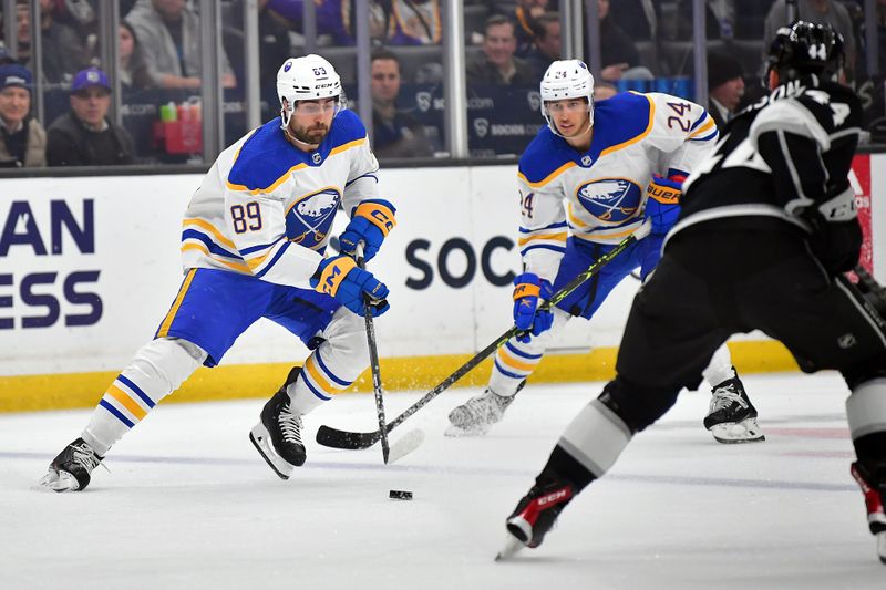 Feb 13, 2023; Los Angeles, California, USA; Buffalo Sabres right wing Alex Tuch (89) moves the puck as center Dylan Cozens (24) trails against the Los Angeles Kings during the first period at Crypto.com Arena. Mandatory Credit: Gary A. Vasquez-USA TODAY Sports