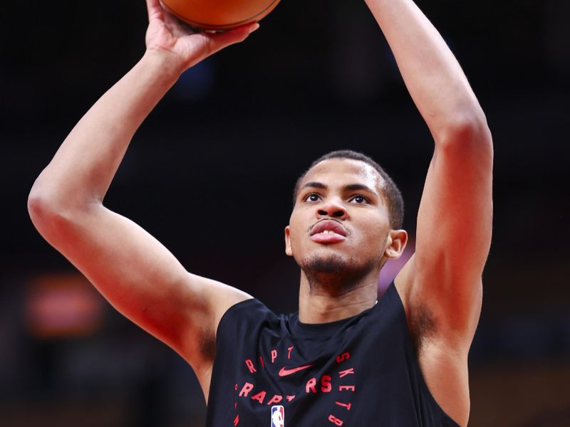 TORONTO, CANADA - MARCH 23:  Orlando Robinson #21 of the Toronto Raptors warms up before the game against the San Antonio Spurs on March 23, 2025 at the Scotiabank Arena in Toronto, Ontario, Canada.  NOTE TO USER: User expressly acknowledges and agrees that, by downloading and or using this Photograph, user is consenting to the terms and conditions of the Getty Images License Agreement.  Mandatory Copyright Notice: Copyright 2025 NBAE (Photo by Vaughn Ridley/NBAE via Getty Images)