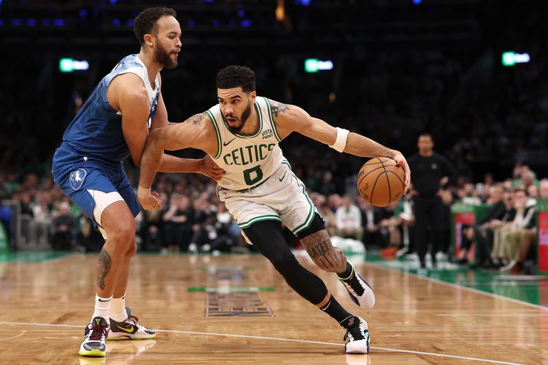 BOSTON, MASSACHUSETTS - JANUARY 10: Kyle Anderson #1 of the Minnesota Timberwolves defends Jayson Tatum #0 of the Boston Celtics  at TD Garden on January 10, 2024 in Boston, Massachusetts. The Celtics defeat the Timberwolves 127-120 in overtime. NOTE TO USER: User expressly acknowledges and agrees that, by downloading and or using this photograph, user is consenting to the terms and conditions of the Getty Images License Agreement.  (Photo by Maddie Meyer/Getty Images)