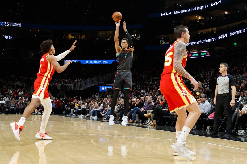 ATLANTA, GA - JANUARY 13: Patrick Baldwin #7 of the Washington Wizards three point basket during the game against the Atlanta Hawks on January 13, 2024 at State Farm Arena in Atlanta, Georgia.  NOTE TO USER: User expressly acknowledges and agrees that, by downloading and/or using this Photograph, user is consenting to the terms and conditions of the Getty Images License Agreement. Mandatory Copyright Notice: Copyright 2024 NBAE (Photo by Mercedes Oliver/NBAE via Getty Images)