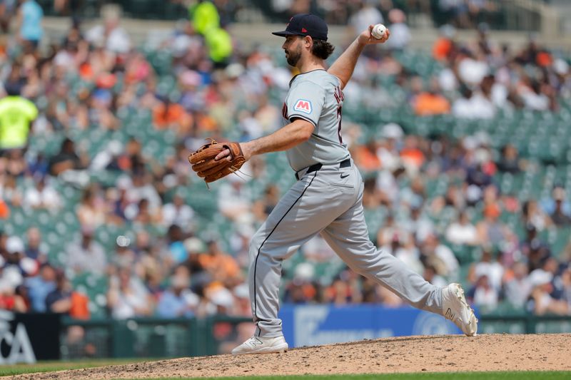 Jul 11, 2024; Detroit, Michigan, USA;  Cleveland Guardians catcher Austin Hedges (27) pitches in the seventh inning against the Detroit Tigers at Comerica Park. Mandatory Credit: Rick Osentoski-USA TODAY Sports