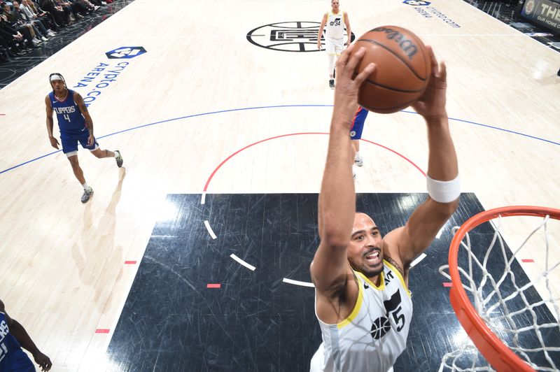 LOS ANGELES, CA - APRIL 5: Talen Horton-Tucker #5 of the Utah Jazz slam dunk the ball during the game on April 5, 2024 at Crypto.Com Arena in Los Angeles, California. NOTE TO USER: User expressly acknowledges and agrees that, by downloading and/or using this Photograph, user is consenting to the terms and conditions of the Getty Images License Agreement. Mandatory Copyright Notice: Copyright 2024 NBAE (Photo by Adam Pantozzi/NBAE via Getty Images)