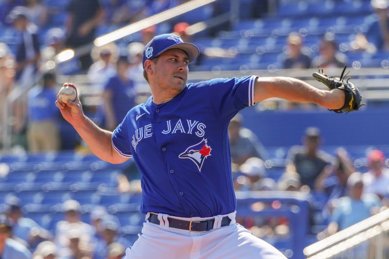 Feb 28, 2023; Dunedin, Florida, USA; Toronto Blue Jays relief pitcher Erik Swanson (50) throws a pitch during the fourth inning against the Detroit Tigers at TD Ballpark. Mandatory Credit: Mike Watters-USA TODAY Sports