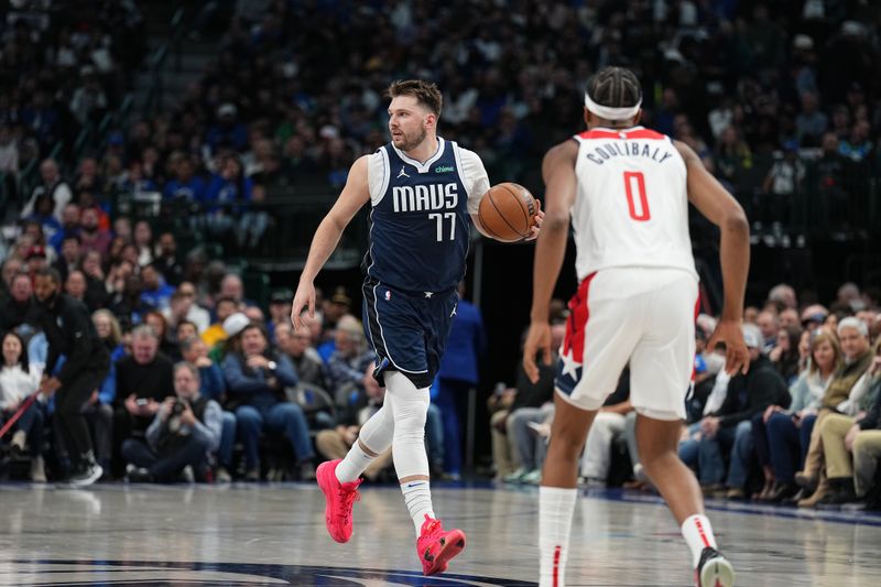 DALLAS, TX - FEBRUARY 12: Luka Doncic #77 of the Dallas Mavericks handles the ball during the game against the Washington Wizards on February 12, 2024 at the American Airlines Center in Dallas, Texas. NOTE TO USER: User expressly acknowledges and agrees that, by downloading and or using this photograph, User is consenting to the terms and conditions of the Getty Images License Agreement. Mandatory Copyright Notice: Copyright 2024 NBAE (Photo by Glenn James/NBAE via Getty Images)