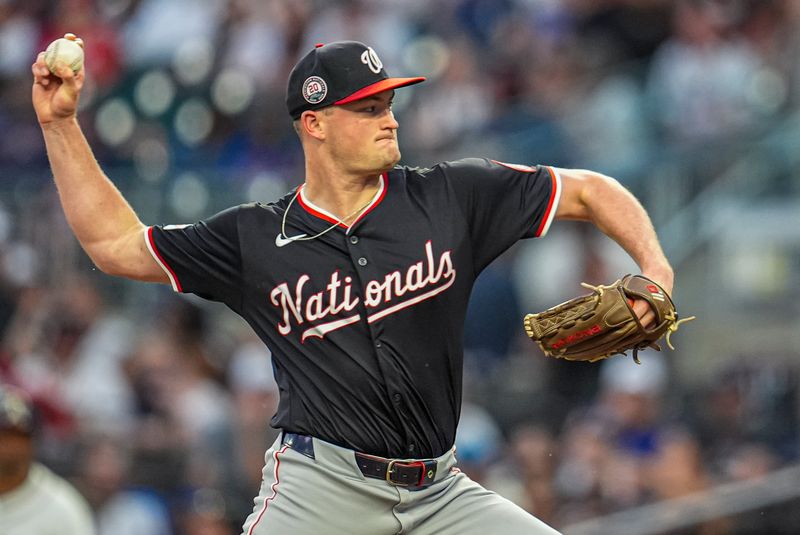Sep 23, 2025; Cumberland, Georgia, USA; Washington Nationals starting pitcher Brad Lord (61) pitches against the Atlanta Braves during the first inning at Truist Park. Mandatory Credit: Dale Zanine-Imagn Images