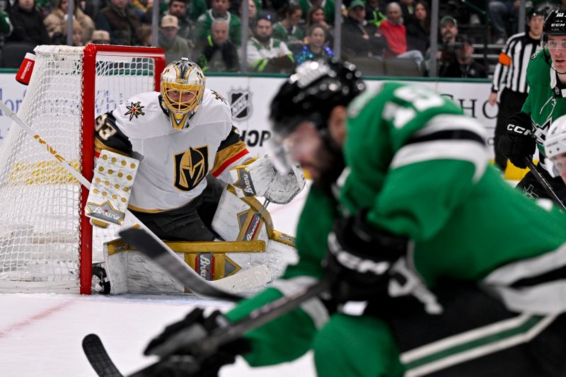 Jan 24, 2025; Dallas, Texas, USA; Vegas Golden Knights goaltender Adin Hill (33) faces a shot from Dallas Stars center Colin Blackwell (15) during the second period at the American Airlines Center. Mandatory Credit: Jerome Miron-Imagn Images