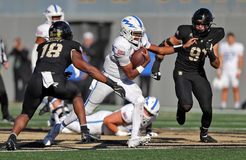 Nov 2, 2024; West Point, New York, USA; Air Force Falcons quarterback Quentin Hayes (7) runs by Army Black Knights linebacker Elo Modozie (18) and Army Black Knights defensive lineman Trey Sofia (91) during the second half at Michie Stadium. Mandatory Credit: Danny Wild-Imagn Images