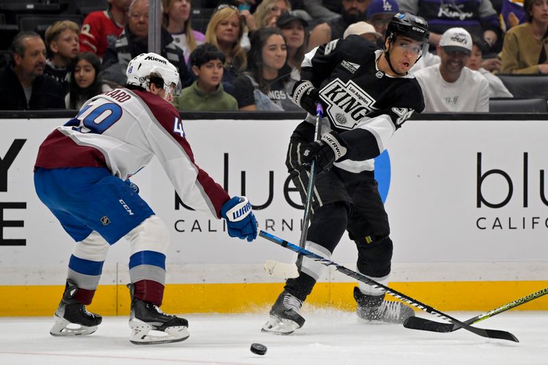 Apr 12, 2025; Los Angeles, California, USA; Colorado Avalanche defenseman Samuel Girard (49) defends a pass by Los Angeles Kings right wing Quinton Byfield (55) in the second period at Crypto.com Arena. Mandatory Credit: Jayne Kamin-Oncea-Imagn Images