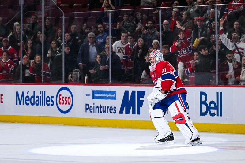 Mar 12, 2024; Montreal, Quebec, CAN; Montreal Canadiens goalie Cayden Primeau (30) first star of the game skates on the ice after saluting the crowd after the end of the game against the Columbus Blue Jackets at Bell Centre. Mandatory Credit: David Kirouac-USA TODAY Sports