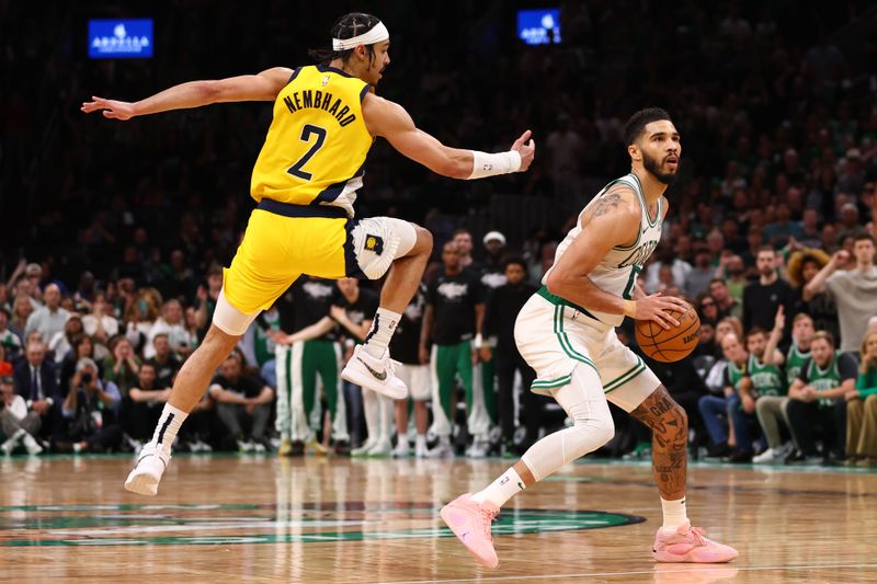 BOSTON, MASSACHUSETTS - MAY 21: Jayson Tatum #0 of the Boston Celtics shoots the ball against Andrew Nembhard #2 of the Indiana Pacers during overtime in Game One of the Eastern Conference Finals at TD Garden on May 21, 2024 in Boston, Massachusetts. NOTE TO USER: User expressly acknowledges and agrees that, by downloading and or using this photograph, User is consenting to the terms and conditions of the Getty Images License Agreement. (Photo by Maddie Meyer/Getty Images)