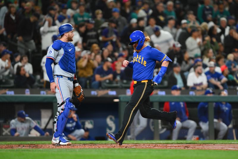 Sep 14, 2024; Seattle, Washington, USA; Seattle Mariners first baseman Justin Turner (2) scores a run against the Texas Rangers during the second inning at T-Mobile Park. Mandatory Credit: Steven Bisig-Imagn Images