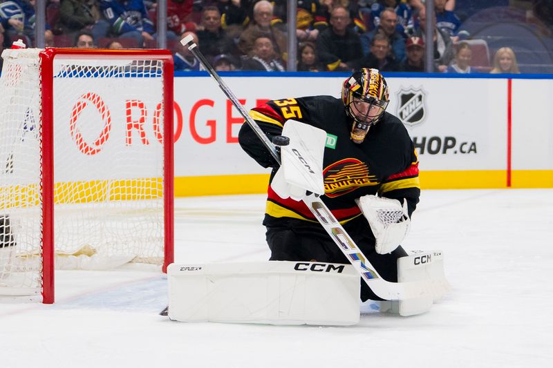 Feb 15, 2024; Vancouver, British Columbia, CAN; Vancouver Canucks goalie Thatcher Demko (35) makes a save against the Detroit Red Wings in the second period at Rogers Arena. Mandatory Credit: Bob Frid-USA TODAY Sports