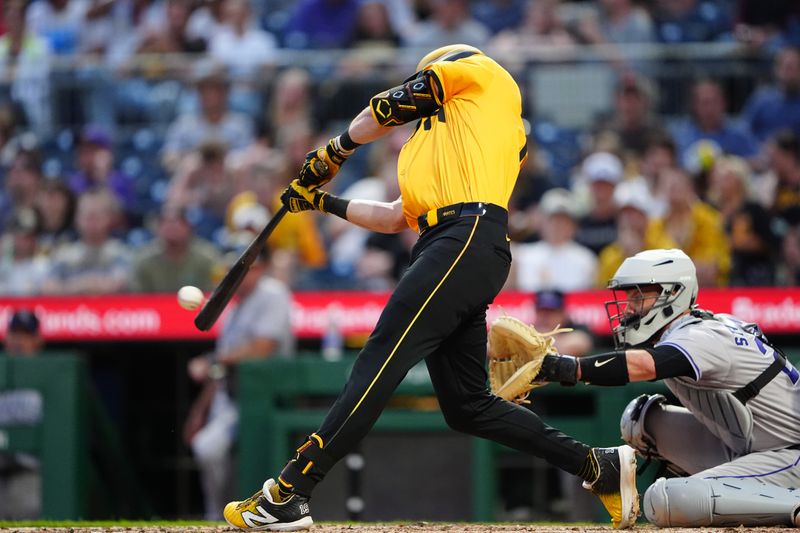 May 3, 2024; Pittsburgh, Pennsylvania, USA; Pittsburgh Pirates second baseman Jared Triolo (19) hits a single against the Colorado Rockies during the fifth inning at PNC Park. Mandatory Credit: Gregory Fisher-USA TODAY Sports