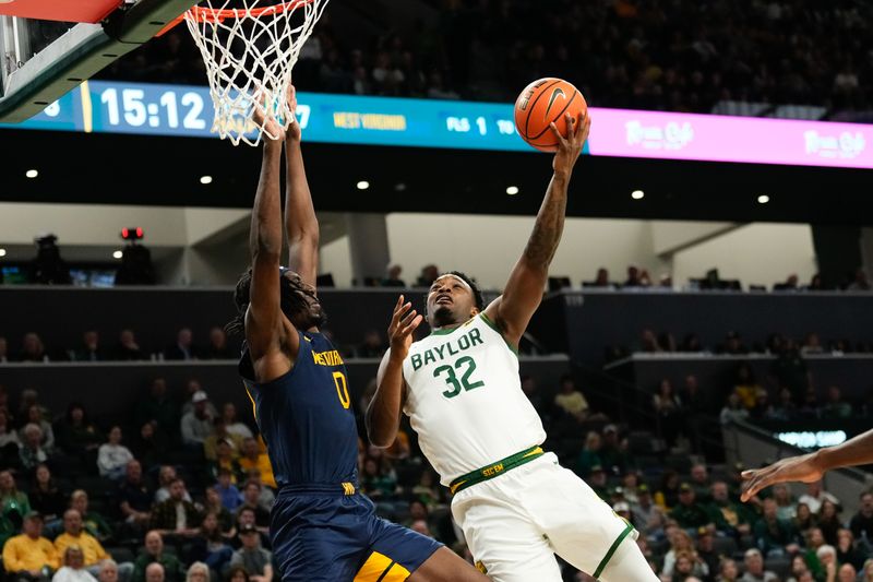 Feb 15, 2025; Waco, Texas, USA; Baylor Bears guard Jalen Celestine (32) shoots as West Virginia Mountaineers center Eduardo Andre (0) defends during the first half at Paul and Alejandra Foster Pavilion. Mandatory Credit: Chris Jones-Imagn Images