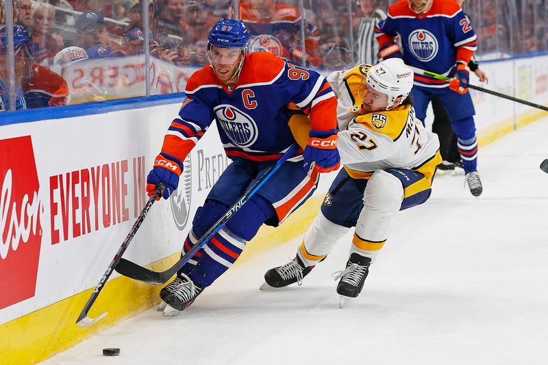 Jan 27, 2024; Edmonton, Alberta, CAN;  Edmonton Oilers forward Connor McDavid (97) carries the puck around Nashville Predators defensemen Ryan McDonagh (27) during the first period at Rogers Place. Mandatory Credit: Perry Nelson-USA TODAY Sports