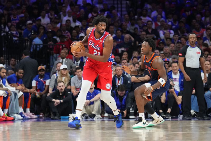 PHILADELPHIA, PA - APRIL 28: Joel Embiid #21 of the Philadelphia 76ers looks to pass the ball during the game against the New York Knicks during Round 1 Game 4 of the 2024 NBA Playoffs on April 28, 2024 at the Wells Fargo Center in Philadelphia, Pennsylvania NOTE TO USER: User expressly acknowledges and agrees that, by downloading and/or using this Photograph, user is consenting to the terms and conditions of the Getty Images License Agreement. Mandatory Copyright Notice: Copyright 2024 NBAE (Photo by Jesse D. Garrabrant/NBAE via Getty Images)