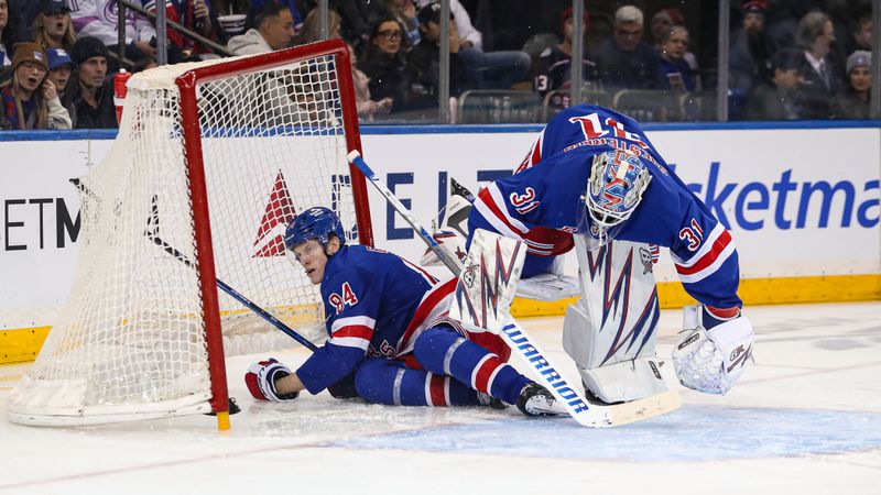 Jan 18, 2025; New York, New York, USA; New York Rangers center Adam Edstrom (84) collides with New York Rangers goalie Igor Shesterkin (31) behind the net during the second period against the Columbus Blue Jackets at Madison Square Garden. Mandatory Credit: Danny Wild-Imagn Images