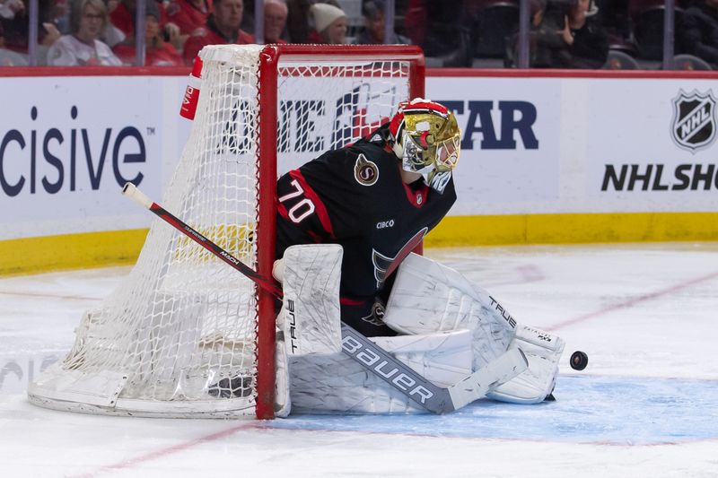 Apr 4, 2024; Ottawa, Ontario, CAN; A shot from behind gets past Ottawa Senators goalie Joonas Korpisalo (70) in the second period against the Florida Panthers at the Canadian Tire Centre. Mandatory Credit: Marc DesRosiers-USA TODAY Sports