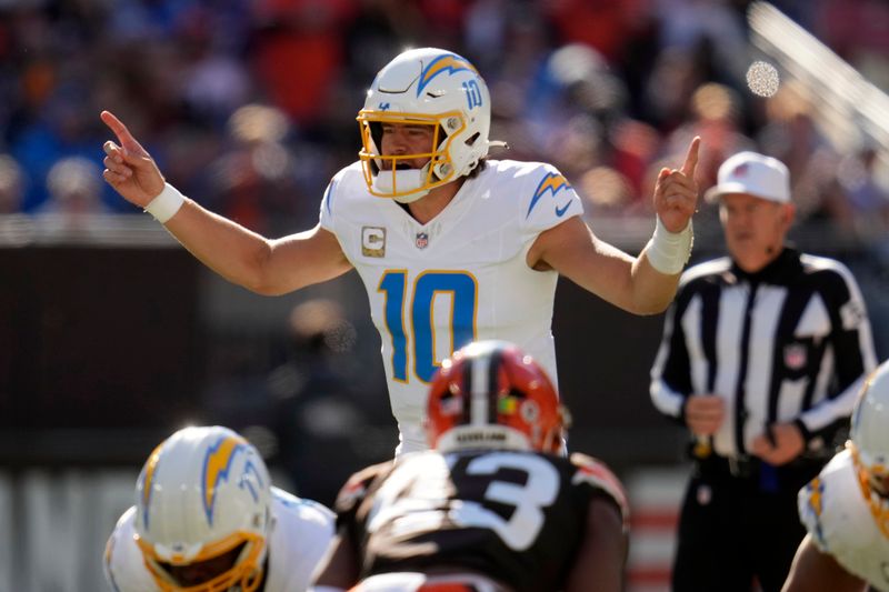 Los Angeles Chargers quarterback Justin Herbert calls a play against the Cleveland Browns in the first half of an NFL football game Sunday, Nov. 3, 2024, in Cleveland. (AP Photo/Sue Ogrocki)