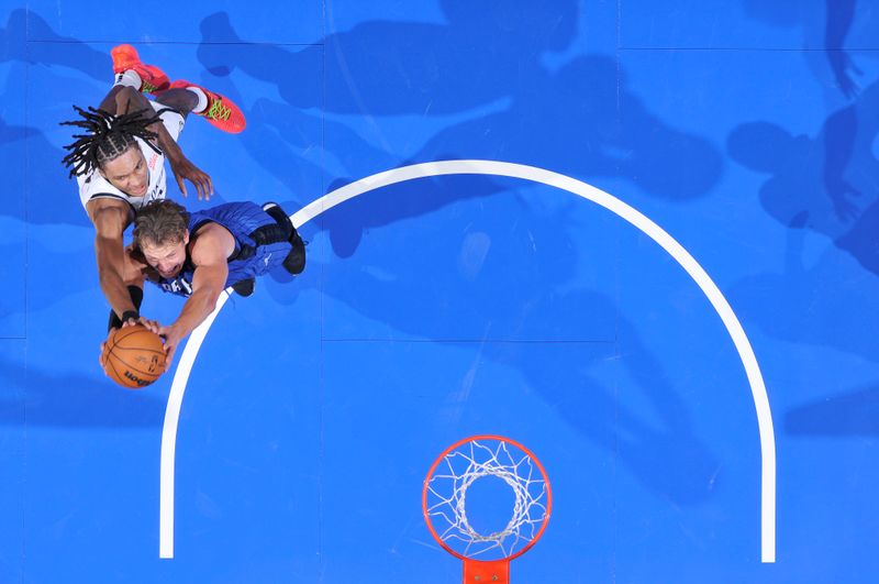 ORLANDO, FL - OCTOBER 25: Noah Clowney #21 of the Brooklyn Nets  blocks the basket during the game against the Orlando Magic on October 25, 2024 at Kia Center in Orlando, Florida. NOTE TO USER: User expressly acknowledges and agrees that, by downloading and or using this photograph, User is consenting to the terms and conditions of the Getty Images License Agreement. Mandatory Copyright Notice: Copyright 2024 NBAE (Photo by Fernando Medina/NBAE via Getty Images)