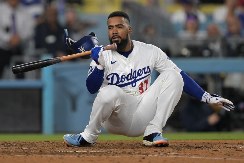 Jun 13, 2024; Los Angeles, California, USA;  Los Angeles Dodgers left fielder Teoscar Hernandez (37) ducks out of the way of a pitch from Texas Rangers relief pitcher Kirby Yates (39) in the ninth inning at Dodger Stadium. Mandatory Credit: Jayne Kamin-Oncea-USA TODAY Sports