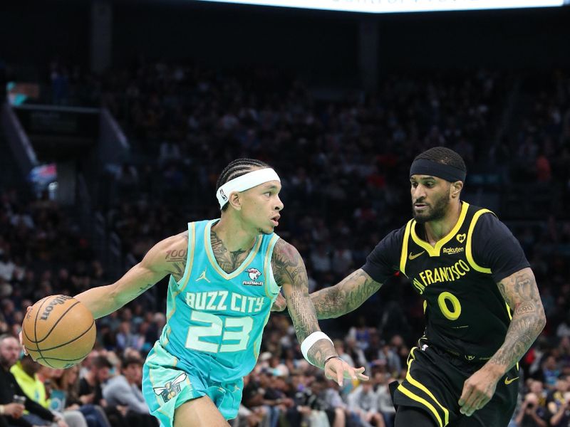 CHARLOTTE, NC - MARCH 29:  Tre Mann #23 of the Charlotte Hornets drives to the basket during the game against the Golden State Warriors on March 29, 2024 at Spectrum Center in Charlotte, North Carolina. NOTE TO USER: User expressly acknowledges and agrees that, by downloading and or using this photograph, User is consenting to the terms and conditions of the Getty Images License Agreement.  Mandatory Copyright Notice:  Copyright 2024 NBAE (Photo by Brock Williams-Smith/NBAE via Getty Images)