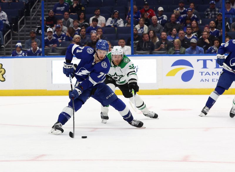 Dec 4, 2023; Tampa, Florida, USA; Tampa Bay Lightning center Anthony Cirelli (71) scores a goal against the Dallas Stars during the third period at Amalie Arena. Mandatory Credit: Kim Klement Neitzel-USA TODAY Sports