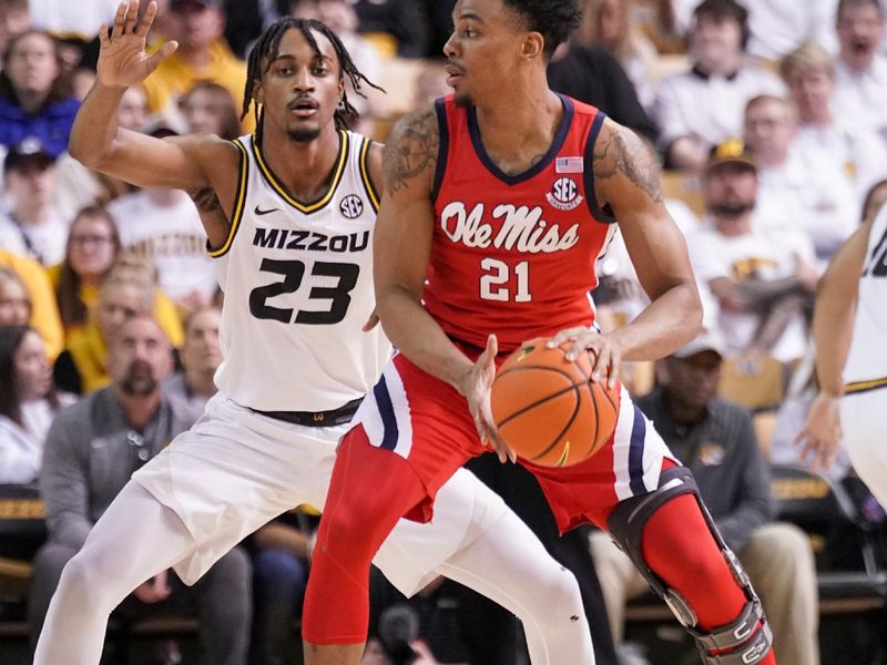 Mar 4, 2023; Columbia, Missouri, USA; Mississippi Rebels forward Robert Allen (21) dribbles the ball as Missouri Tigers forward Aidan Shaw (23) defends during the first half at Mizzou Arena. Mandatory Credit: Denny Medley-USA TODAY Sports