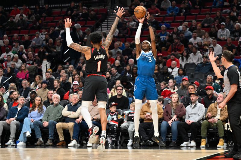 PORTLAND, OREGON - FEBRUARY 15: Jaden McDaniels #3 of the Minnesota Timberwolves shoots from the three-point line against Anfernee Simons #1 of the Portland Trail Blazers during the first quarter at the Moda Center on February 15, 2024 in Portland, Oregon. NOTE TO USER: User expressly acknowledges and agrees that, by downloading and or using this photograph, User is consenting to the terms and conditions of the Getty Images License Agreement. (Photo by Alika Jenner/Getty Images)