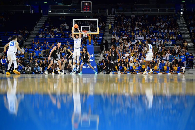 January 14, 2024; Los Angeles, California, USA; UCLA Bruins forward Berke Buyuktuncel (9) controls the ball against the Washington Huskies during the first half at Pauley Pavilion. Mandatory Credit: Gary A. Vasquez-USA TODAY Sports