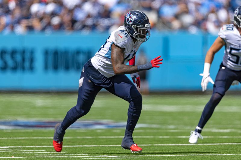 Tennessee Titans linebacker Arden Key (49) rushes during their NFL football game against the Los Angeles Chargers Sunday, Sept. 17, 2023, in Nashville, Tenn. (AP Photo/Wade Payne)